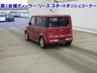 Nissan CUBE лот № 3517 оценка RA  с аукциона в Японии 1