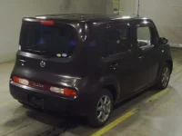 Nissan CUBE лот № 7030 оценка RA  с аукциона в Японии 1