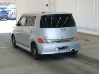 Toyota BB лот № 2212 оценка RA  с аукциона в Японии 1