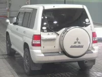 Mitsubishi PAJERO IO лот № 7074 оценка 3.5  с аукциона в Японии 1