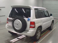 Mitsubishi PAJERO IO лот № 10283 оценка RA  с аукциона в Японии 1