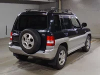 Mitsubishi PAJERO IO лот № 7077 оценка 3.5  с аукциона в Японии 1
