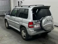 Mitsubishi PAJERO IO лот № 90117 оценка 3  с аукциона в Японии 1
