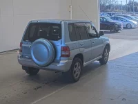 Mitsubishi PAJERO IO лот № 1820 оценка RA  с аукциона в Японии 1