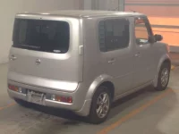 Nissan CUBE лот № 33003 оценка RA  с аукциона в Японии 1