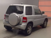 Mitsubishi PAJERO IO лот № 70084 оценка 3.5  с аукциона в Японии 1