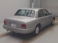 Nissan CRUE лот № 4042 оценка 3.5  с аукциона в Японии 1