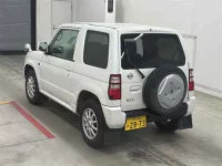 Nissan KIX лот № 90047 оценка R  с аукциона в Японии 1