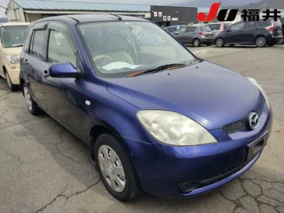 Mazda DEMIO  с аукциона в Японии