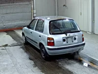 Nissan MARCH лот № 8230 оценка R  с аукциона в Японии 1