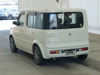 Nissan CUBE лот № 2833 оценка RA  с аукциона в Японии 1