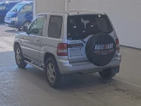 Mitsubishi PAJERO IO лот № 1850 оценка 3.5  с аукциона в Японии 1