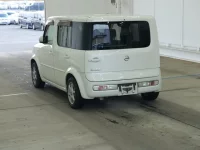 Nissan CUBE лот № 2214 оценка RA  с аукциона в Японии 1