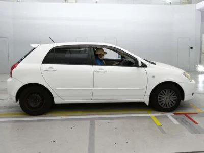 Toyota COROLLA RUNX  с аукциона в Японии