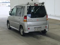 Mitsubishi TOPPO BJ лот № 2555 оценка RA  с аукциона в Японии 1