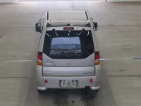 Mitsubishi TOPPO BJ лот № 2555 оценка RA  с аукциона в Японии 2