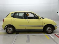 Toyota DUET лот № 10220 оценка 3.5  с аукциона в Японии 1